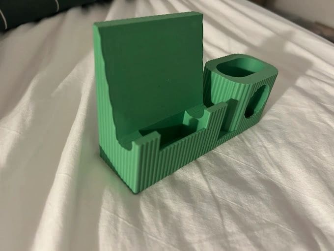 Green 3D-printed organizer on a white surface