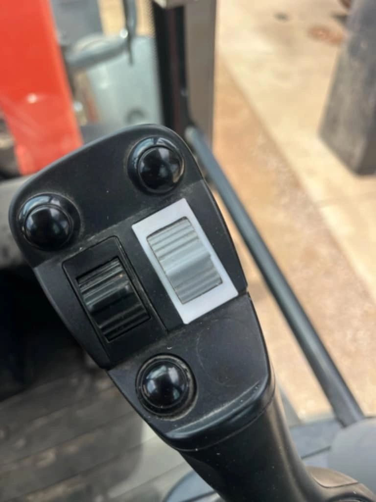 Close-up of an industrial control handle component